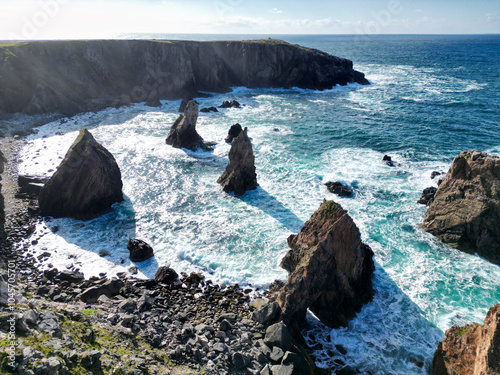 Mangersta sea stacks, natural rock formations in sea off coast Isle of Lewis, Outer Hebrides, Scotland photo