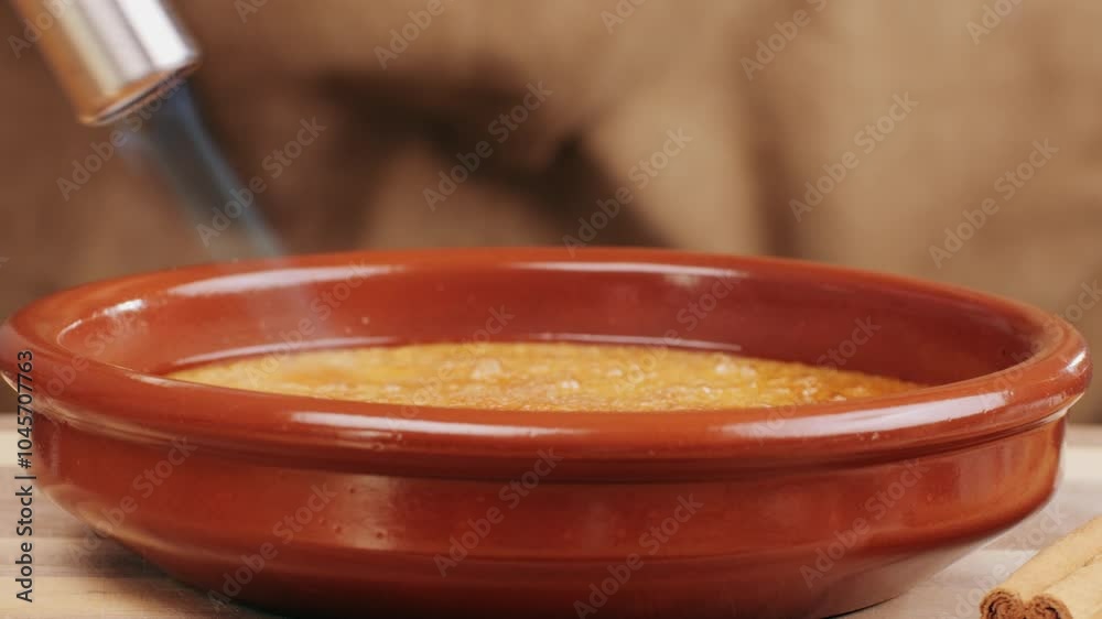 Spanish traditional food, catalonian dessert, crema catalana, catalan cream, spanish dessert close up, cooking. Spanish traditional food, catalonian dessert, crema catalana, catalan cream, spanish dessert close up, cooking.