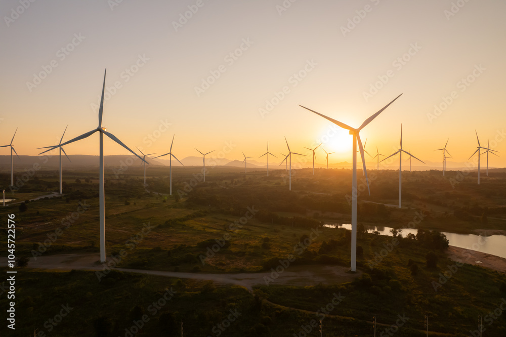 Obraz premium View of wind turbine against sunset sky
