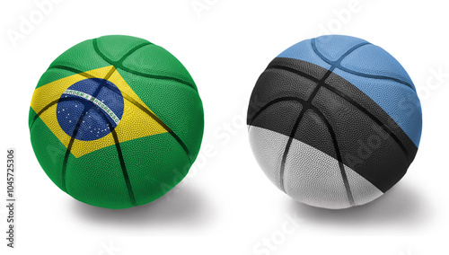 basketball balls with the national flags of estonia and brazil on the white background. photo