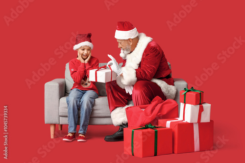 Santa Claus and cute little...