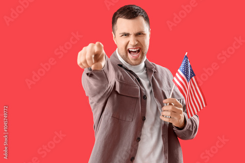 Angry young man with USA fl...