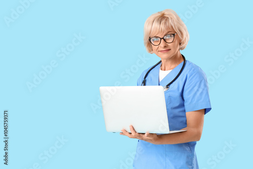 Female doctor with laptop o...