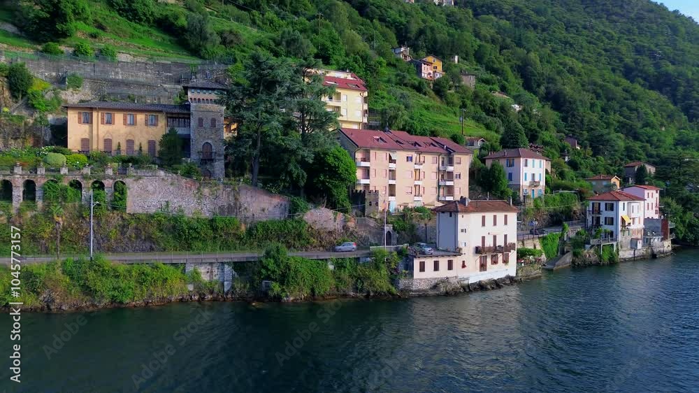 Aerial view of Lake Como. city center. Bell tower. Tourism and romance. Mountains around the lake. Red roofs. Green Planet. Sailing yacht. Powerboat. travel to Italy, Bellano, 12.09.2024 Aerial view of Lake Como. city center. Bell tower. Tourism and romance. Mountains around the lake. Red roofs. Green Planet. Sailing yacht. Powerboat. travel to Italy, Bellano, 12.09.2024