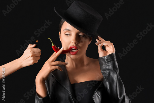 Sexy young woman with chili...