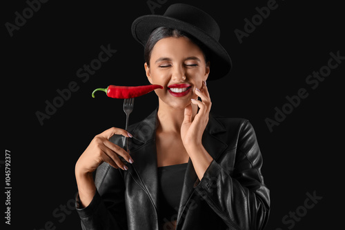Sexy young woman with chili...