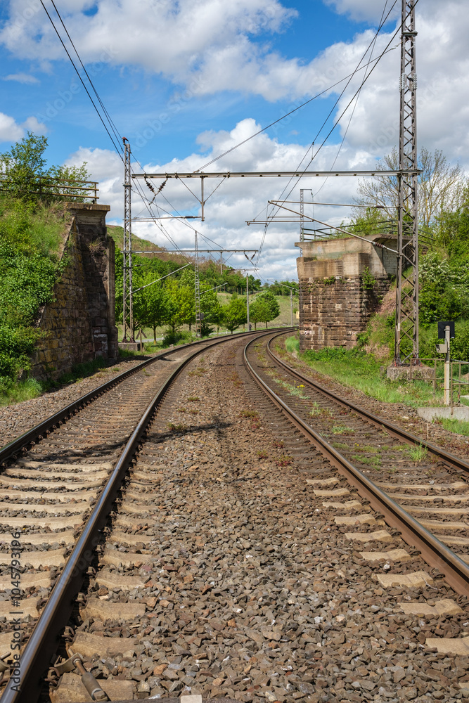 Railway outdoors on beautiful summer day. Industrial landscape with rails and railway.