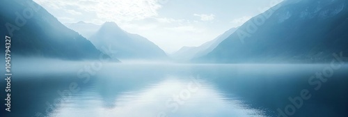 Beautiful lake in misty morning. Mountains, forest and clouds reflected in the calm water surface. Norwegian dark autumn landscape. Nature, ecology, eco tourism. Travel and vacation concept