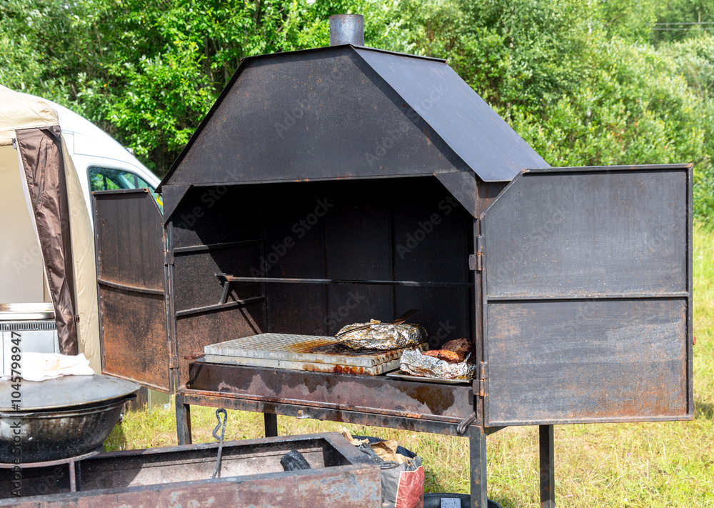 Metal stove for cooking food on coals. BBQ stove Metal stove for cooking food on coals. BBQ stove