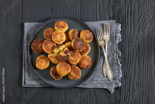 Northern Pike fish cakes on dark grey plate photo