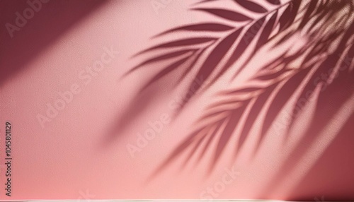 blurred shadow from palm leaves on the light pink wall minimal abstract background for product presentation spring and summer