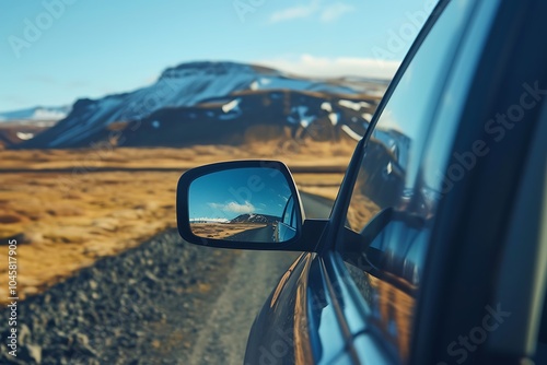 View from the car mirror on a mountain road with sunlight photo