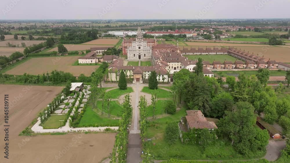 Aerial shot of Certosa di Pavia cathedral a historical monumental complex that includes a monastery and a sanctuary. Pavia ,Italy. Aerial shot of Certosa di Pavia cathedral a historical monumental complex that includes a monastery and a sanctuary. Pavia ,Italy.