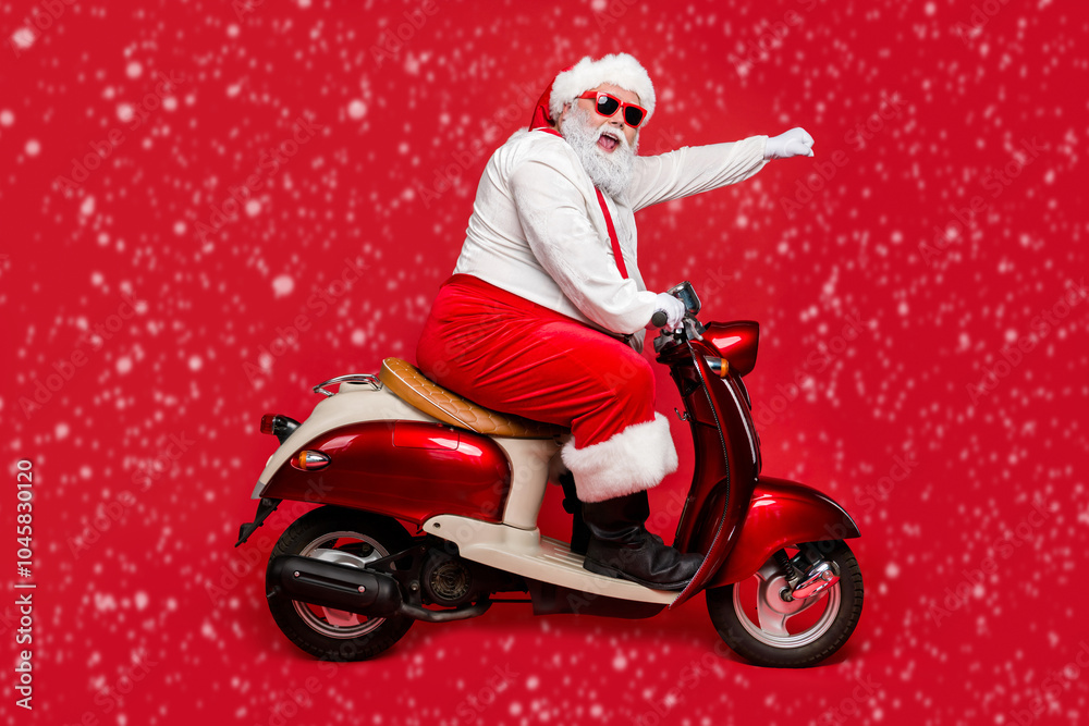 Profile side view portrait of nice bearded cheerful funny funky purposeful Santa Claus riding moped hurry up shopping season North Pole isolated on bright vivid shine vibrant red color background Profile side view portrait of nice bearded cheerful funny funky purposeful Santa Claus riding moped hurry up shopping season North Pole isolated on bright vivid shine vibrant red color background