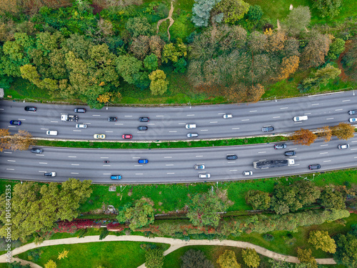 A stunning Aerial View of a Busy Highway that is beautifully Surrounded by Lush Greenery