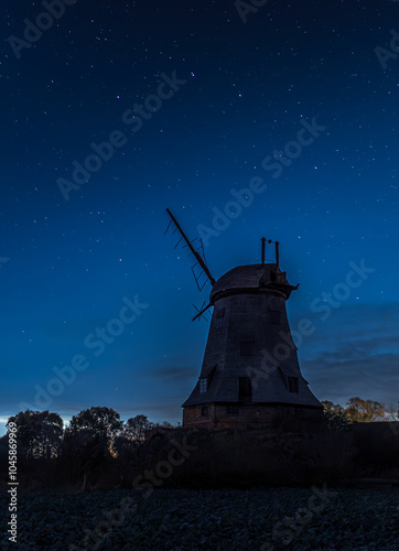 old dutch windmill at night photo