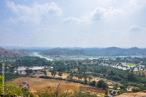 Aerial view of mountains, fields and rivers in the famous historical city of Hampi