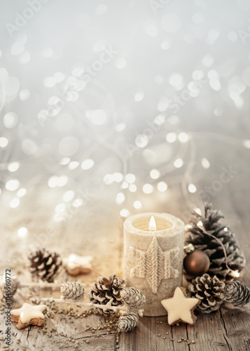 White Christmas candle on rustic wooden boards - Decoration with natural elements, twigs, pine cones and cookies - Advent background with copy space