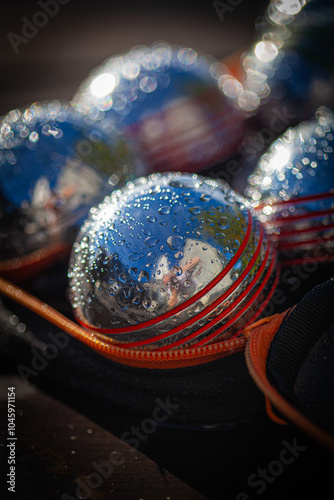 Boules covered in droplets of dew.