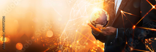 Businessman holding glowing earth globe in hands