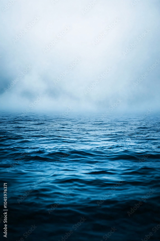 Fototapeta premium calm ocean surface with foggy sky