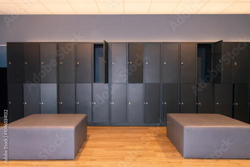 Empty gym locker room with modern benches