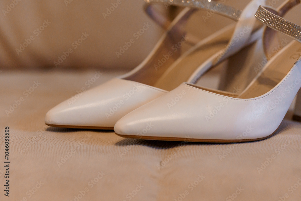 Elegant White High Heels with Sparkling Straps on a Soft Background Elegant White High Heels with Sparkling Straps on a Soft Background