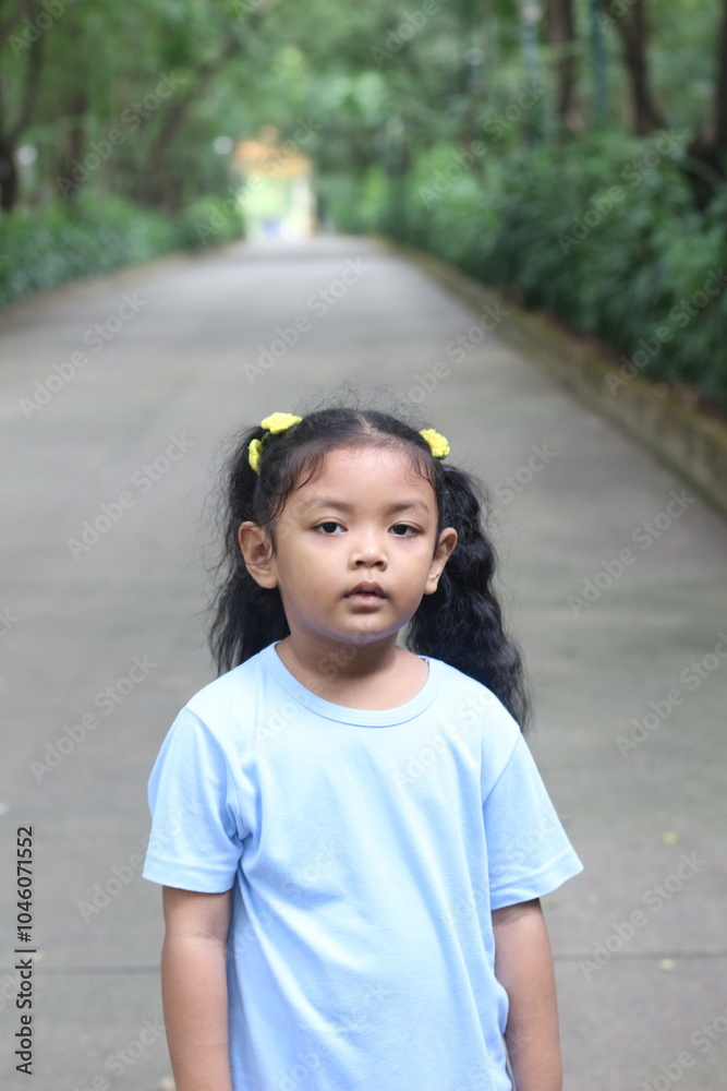 girl in blue dress on nature background