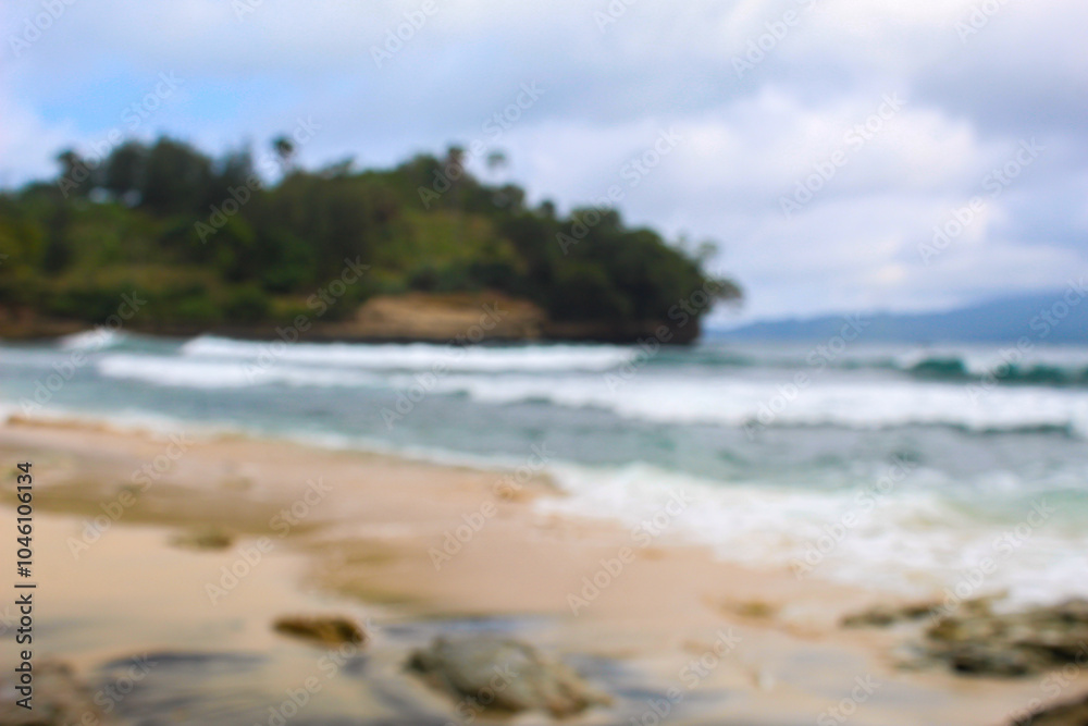 Blur view of white sand beach in summer with sea water and waves washing the shore. Blur view of white sand beach in summer with sea water and waves washing the shore.