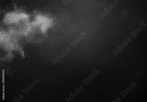 White powder explosion against a black background.