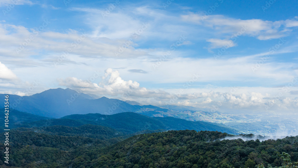Fototapeta premium Natural view countryside of mountain forest with blue sky background. Nature rainforest landscape.