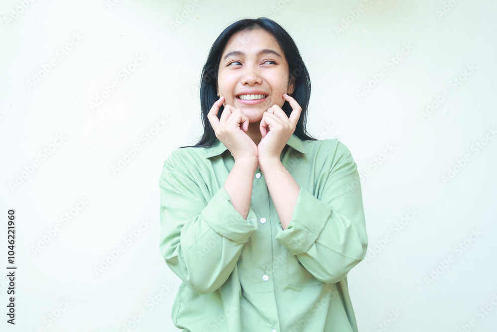 pleased thoughtful asian woman wearing green over size clothes looking aside to empty space thinking and imagine with dreamy face expression standing isolated on white background pleased thoughtful asian woman wearing green over size clothes looking aside to empty space thinking and imagine with dreamy face expression standing isolated on white background