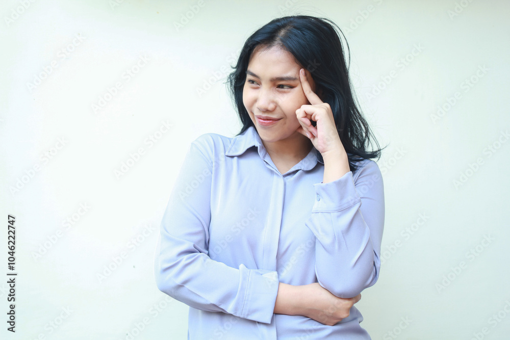 portrait of pensive asian woman thinking and pondering choice looking away and smiling with folded arm and touching her head isolated over white background portrait of pensive asian woman thinking and pondering choice looking away and smiling with folded arm and touching her head isolated over white background