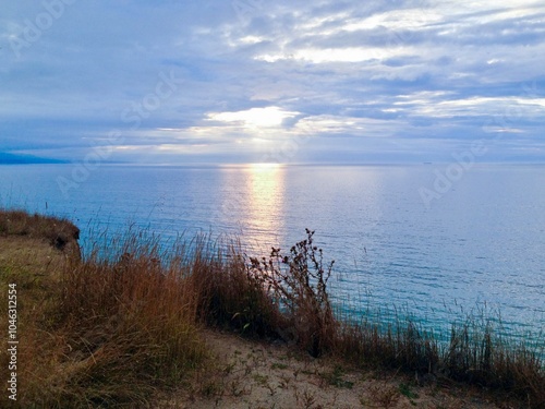 Tranquil Summer Coastline at Dusk: Serene Seascape and Colorful Sky