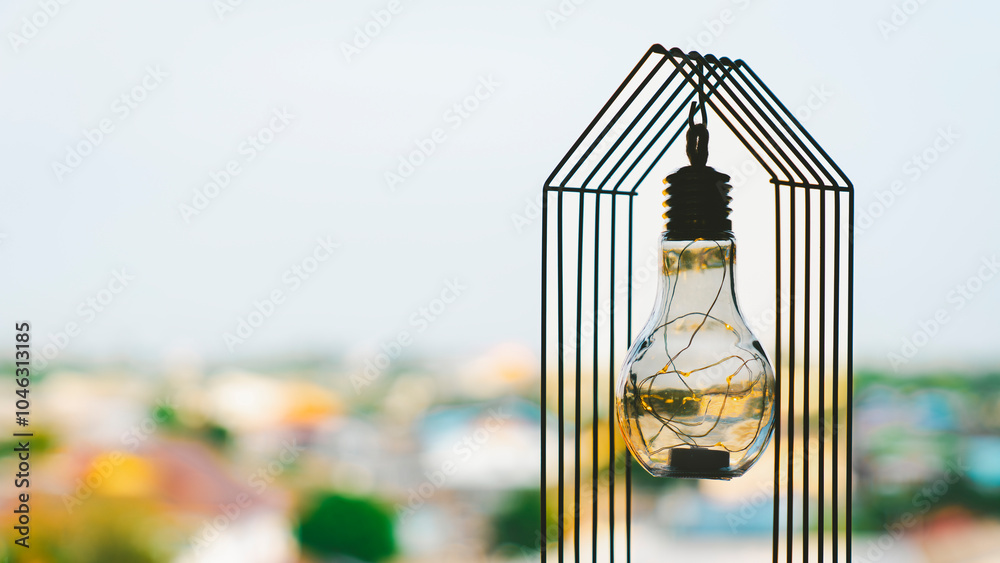 Φωτογραφία Light bulb with house on the table, a symbol for construction, Creative light bulb idea, power energy or business idea concept ecology, loan, mortgage, property or home