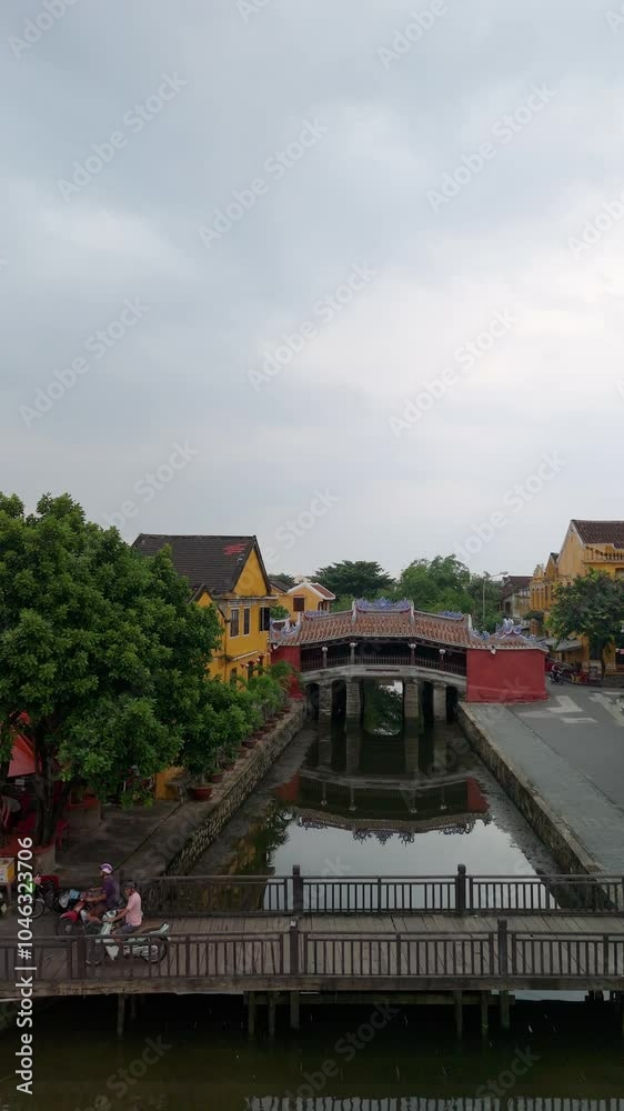 Aerial view of Chua Cau or Japanese Covered ancient Bridge and River in Old city of Hoi An, Vietnam. Vietnamese heritage and culture in Hoian ancient town Aerial view of Chua Cau or Japanese Covered ancient Bridge and River in Old city of Hoi An, Vietnam. Vietnamese heritage and culture in Hoian ancient town