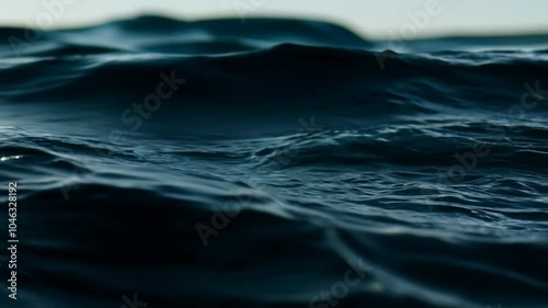 Black ocean close up view, Slow motion shot of water dripping and flowing, dark water waves in detail. 4K Video 