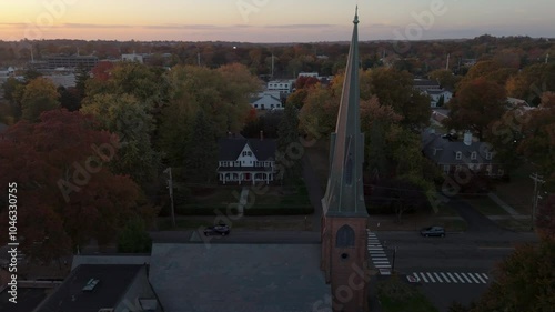 alt autumn sunset flying counter clockwise around church in Fairfield CT photo