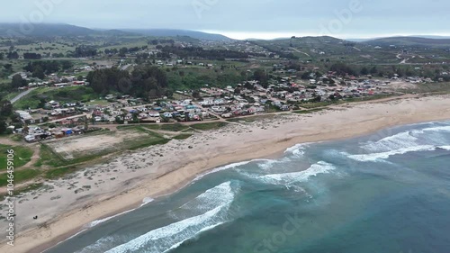 houses on the coastal edge of Pichicuy beach, La Ligua commune, Valparaiso region, country of Chile photo