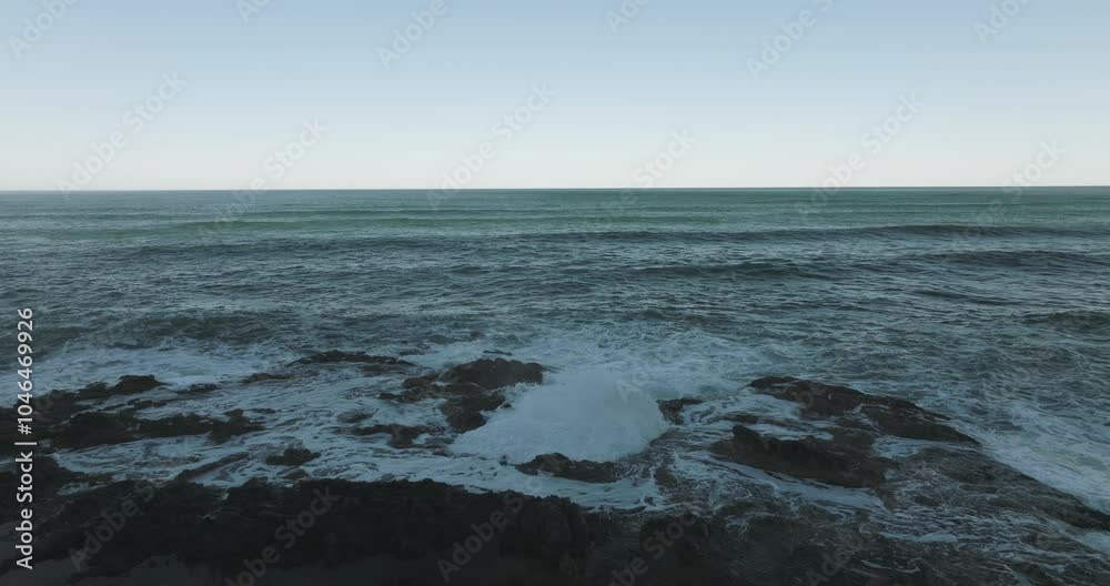 Aerial static of Thor's Well on the Oregon Coast, showcasing the wide expanse of Cape Perpetua's rocky shoreline Aerial static of Thor's Well on the Oregon Coast, showcasing the wide expanse of Cape Perpetua's rocky shoreline