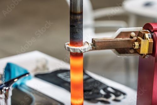 Surface hardening of steel. Induction hardening type of surface hardening . Metal part is induction-heated and then quenched. Quenched metal. Induction heating  process. Electromagnetic induction.