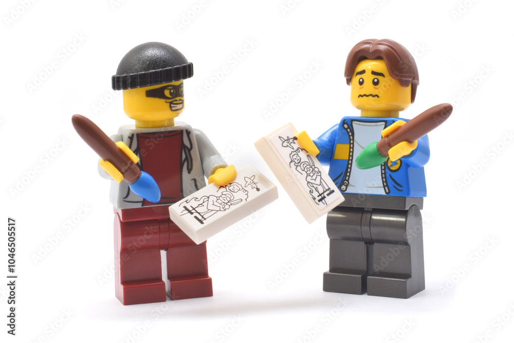 Fototapeta premium Editorial illustrative image to copyright injure. Lego minifigure of thief from Tambov or Indonesia and is standing on a side and copying an idea, picture or art product of author.