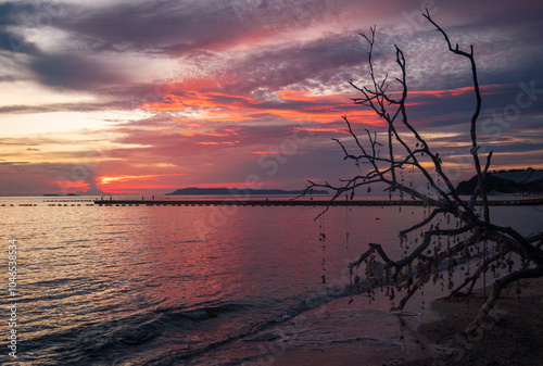 Samai Beach sunset on Koh Lan Thailand south east Asia photo