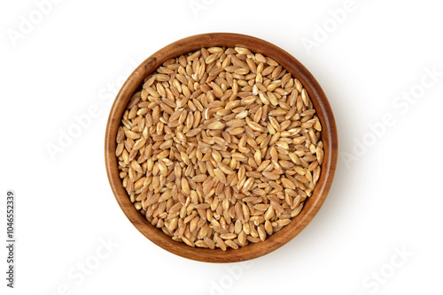 Pearled whole emmer wheat (Farro) in wooden bowl on white background