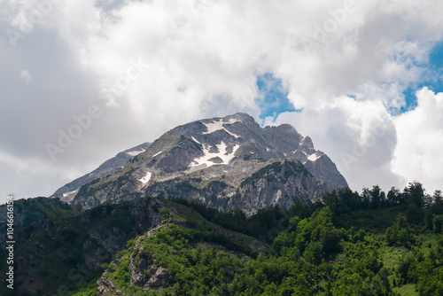 Vista on majestic mountain massif Kolata, Albanian Alps (Accursed Mountains), Valbone Valley National Park, Northern Albania. Scenic hiking trail from Valbona to Theth. Wanderlust in alpine wilderness photo