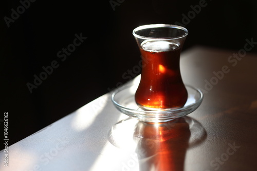 glass of turkish tea on table photo