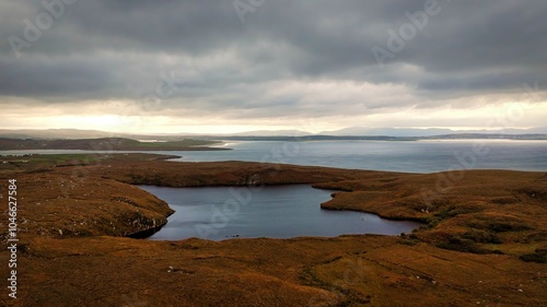 A Serene Coastal Landscape Under a Cloudy Sky, Capturing Natures Dramatic Beauty Completely