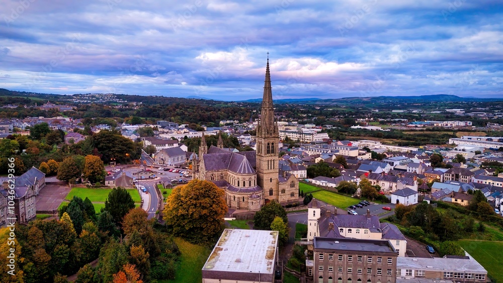 Aerial view over the town of Letterkenny in Ireland in the evening - a breathtaking scenic cityscape at dusk featuring a beautiful and cloudy sky Aerial view over the town of Letterkenny in Ireland in the evening - a breathtaking scenic cityscape at dusk featuring a beautiful and cloudy sky