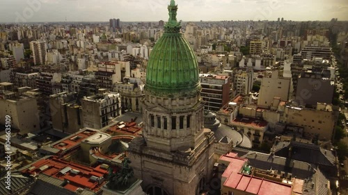 A tower and a dome of the Palace of National Congress of Argentina, cinematic shot, city view, drone, aerial
