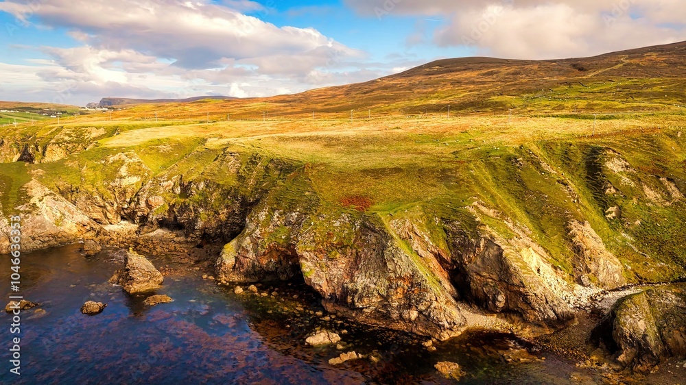 Beautiful Ireland - Enjoy the breathtaking view of a stunning coastal landscape with rocky cliffs and serene waters Beautiful Ireland - Enjoy the breathtaking view of a stunning coastal landscape with rocky cliffs and serene waters
